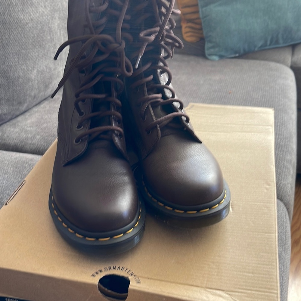 Dr marten brown high top size 8 one is a little lighter than the other
